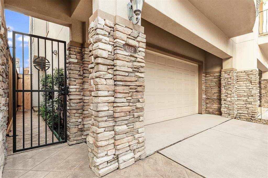 Enter through private gate to front door or park in spacious two car garage