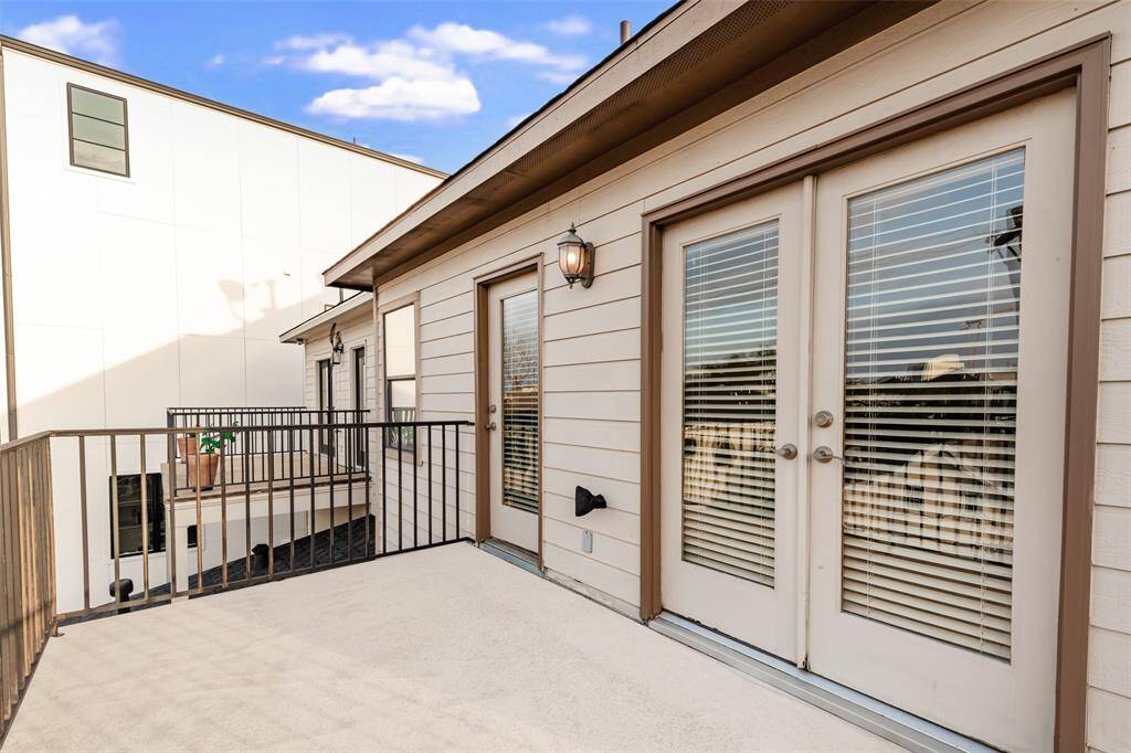 Third floor balcony on North side of house. French doors lead to balcony from secondary bedroom #1 and single door leads to balcony from secondary bedroom #2