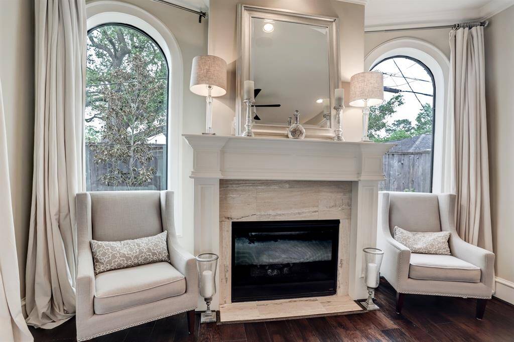 Private fireplace in the primary bedroom.