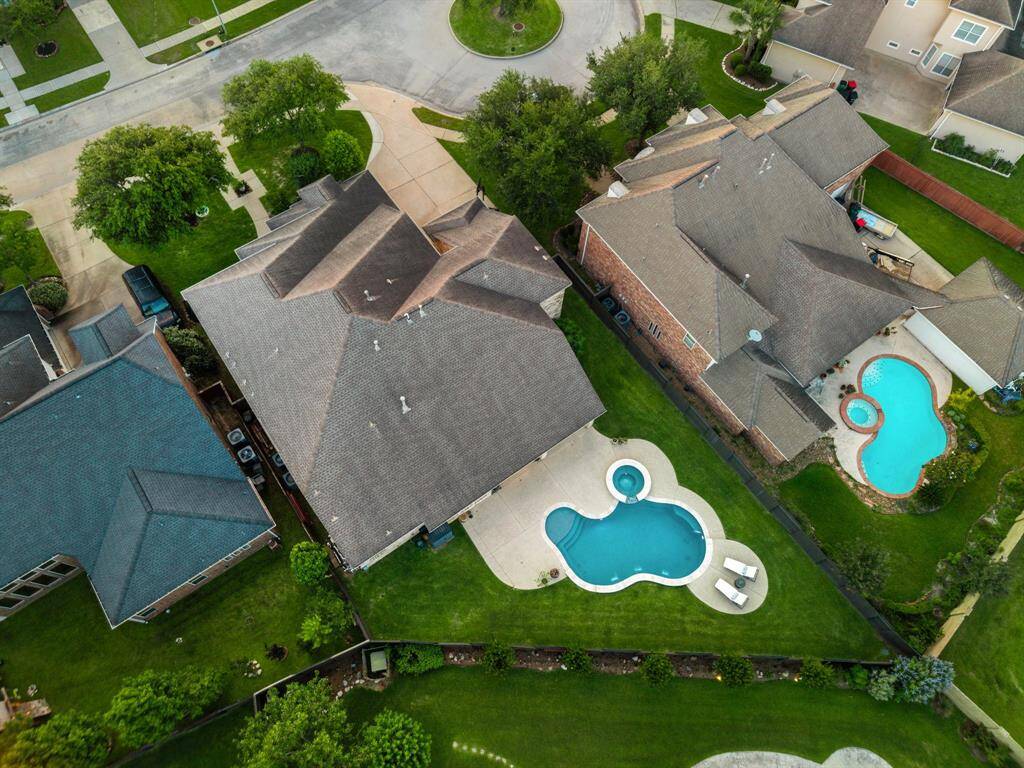 Aerial view of this exceptional home situated in one of the most desirable sections of Lakes on Eldridge North, just a short walk to community pools, playgrounds, and resort-style amenities.