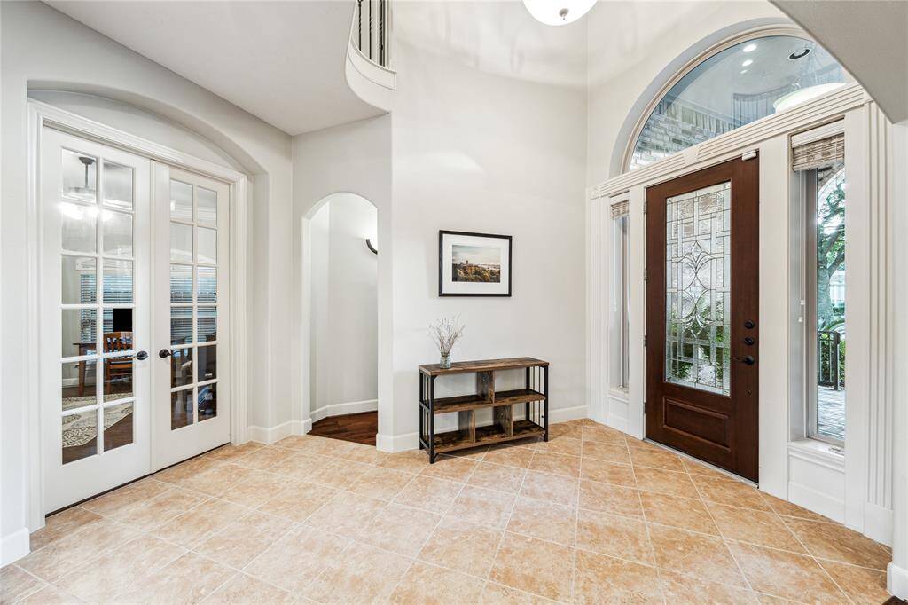 Conveniently located secondary bedroom near the front of the home, featuring a private en suite bathroom and a 36-inch doorway for easy accessibility—perfect for guests or multigenerational living.