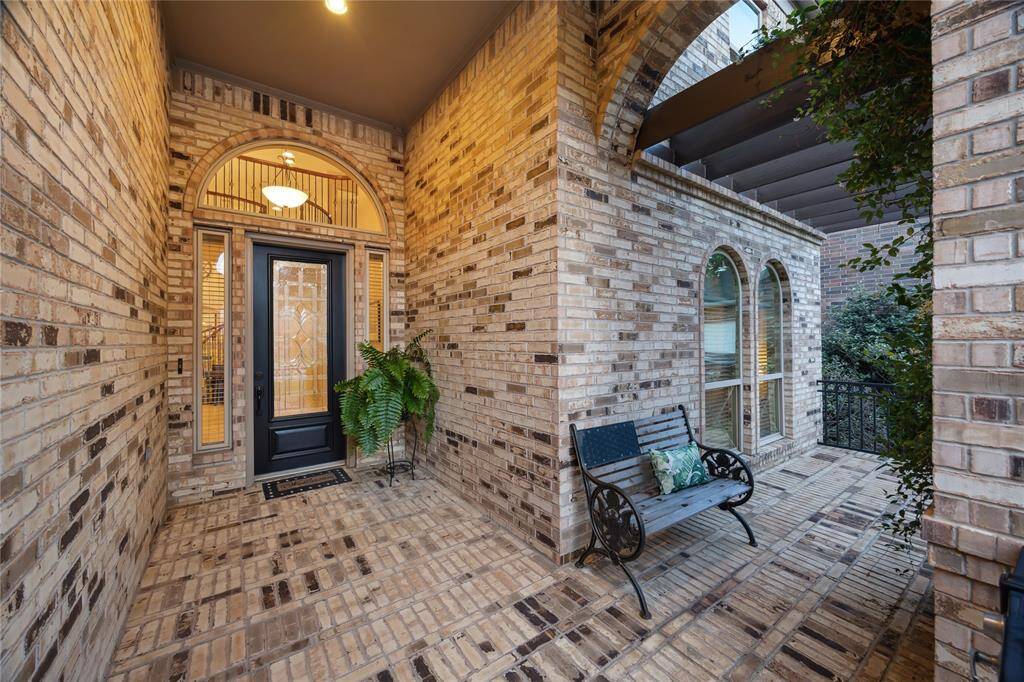 Stunning brick exterior with timeless curb appeal. This home welcomes you with a stately entrance, and manicured landscaping.
