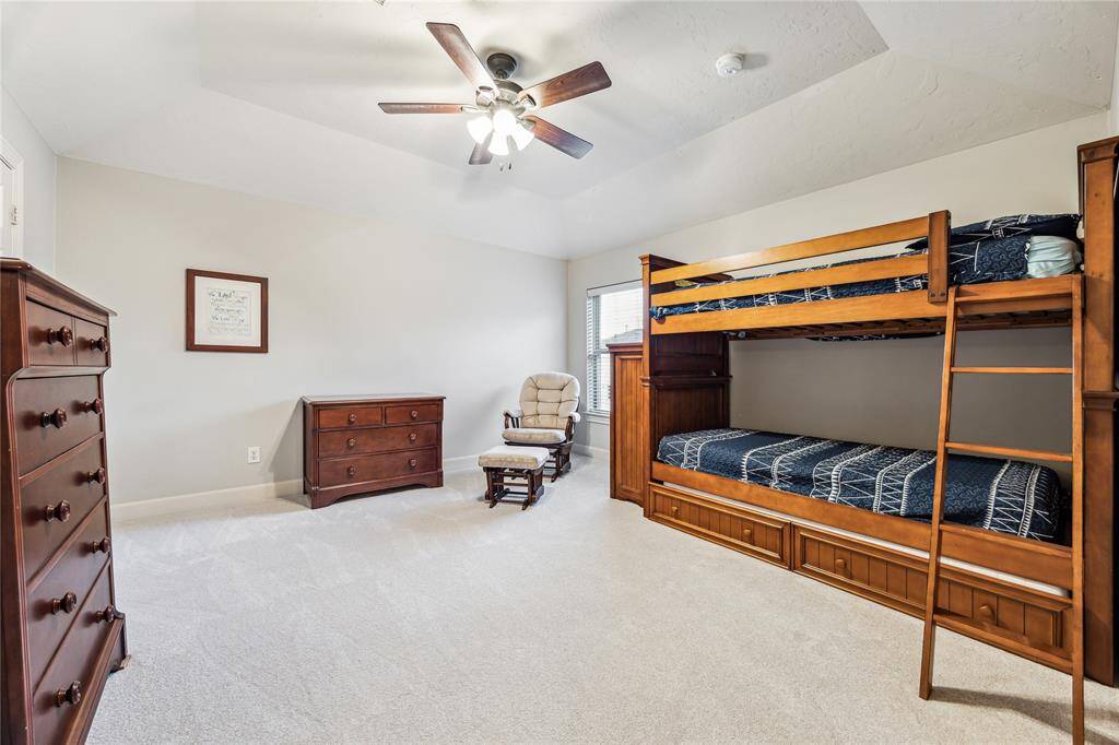 Upstairs features three spacious bedrooms and a versatile flex room, which can easily serve as a 6th bedroom—offering flexibility and ample space for growing families or guests.