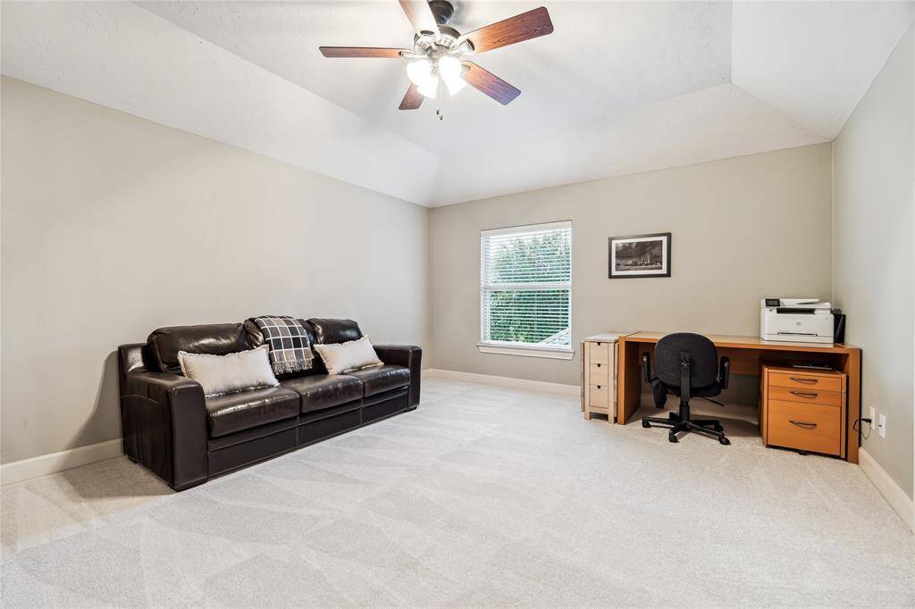 Spacious bedroom located upstairs.