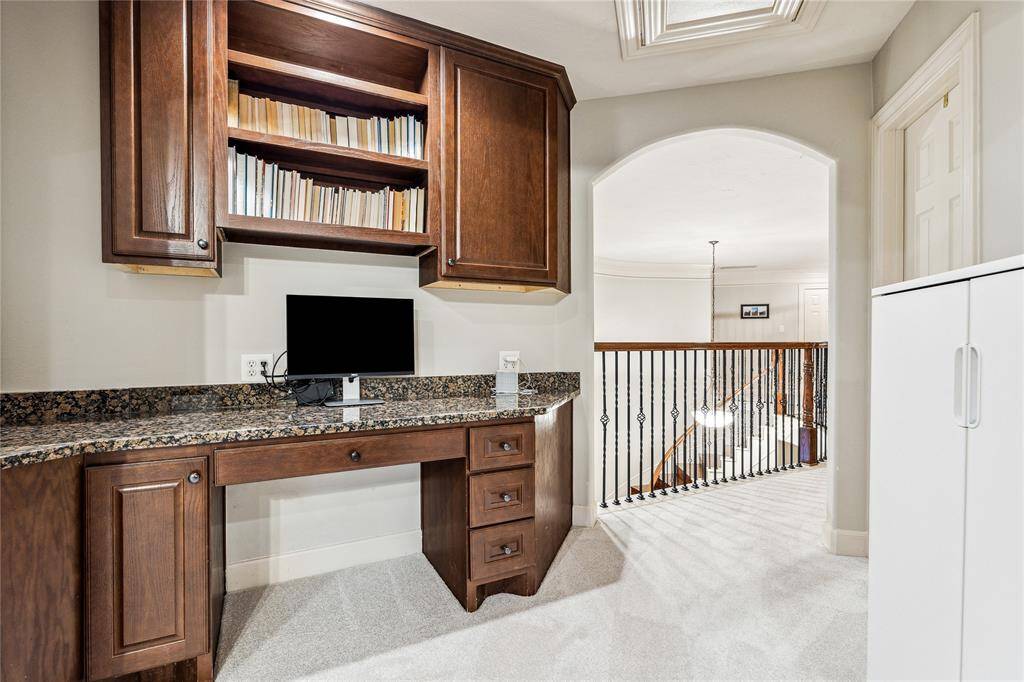 Cozy study nook featuring a built-in desk—ideal for homework, home office tasks, or a quiet space to focus.
