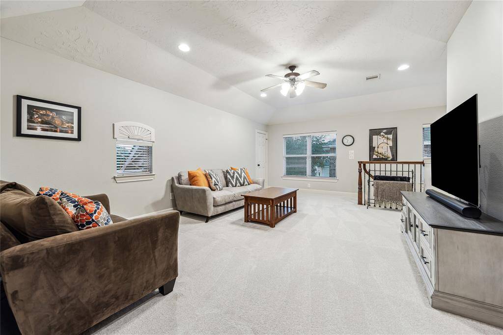Spacious upstairs game room, perfect for entertainment and leisure.