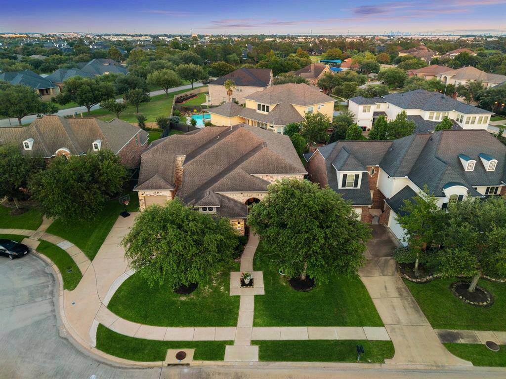 Aerial view showcasing the prime location of this stunning home within the coveted Lakes on Eldridge North gated community. The property is ideally positioned near the community’s lush green spaces, serene lakes, and resort-style amenities, offering both privacy and easy access to nearby pools, walking trails, and recreational areas.