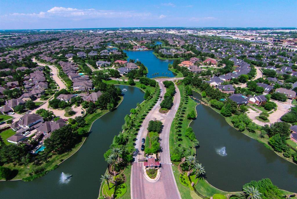 Residents enjoy access to beautifully landscaped common areas, walking trails, and private community pools, with the added benefit of private bus service to prestigious schools like Awty International, British, and Village.