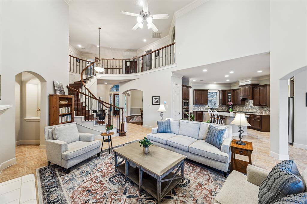 Impressive family room showcasing soaring ceiling heights and an open-concept design.