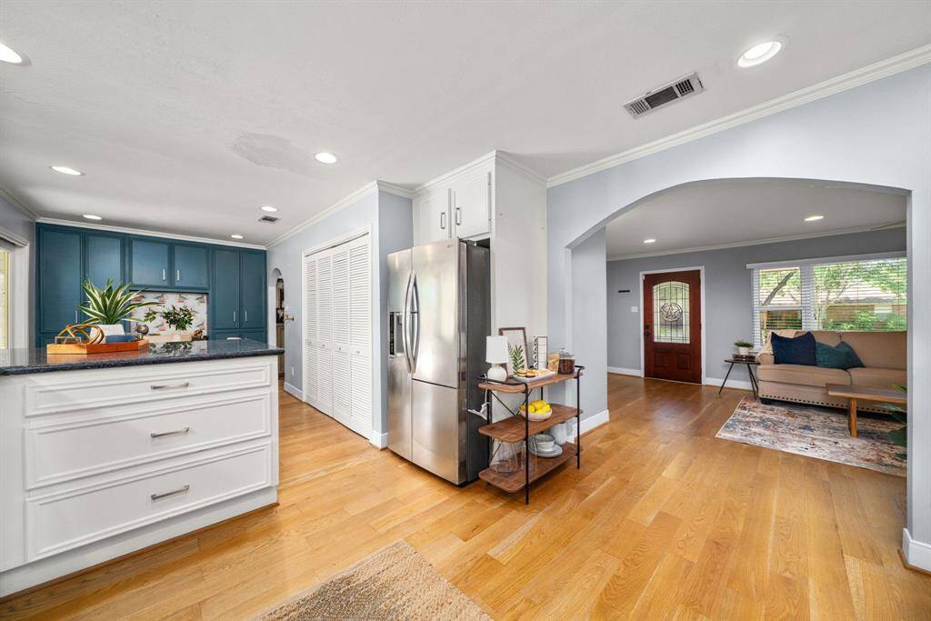 Open, bright & designed for connection—this kitchen flows seamlessly into living spaces with custom built-ins & stylish touches. A home you’ll love to live in!