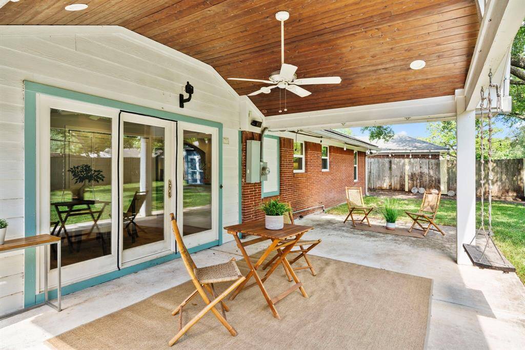 Relax, entertain, or dine outdoors under this spacious covered patio with vaulted wood ceiling & fan. A peaceful backyard retreat with room to enjoy!