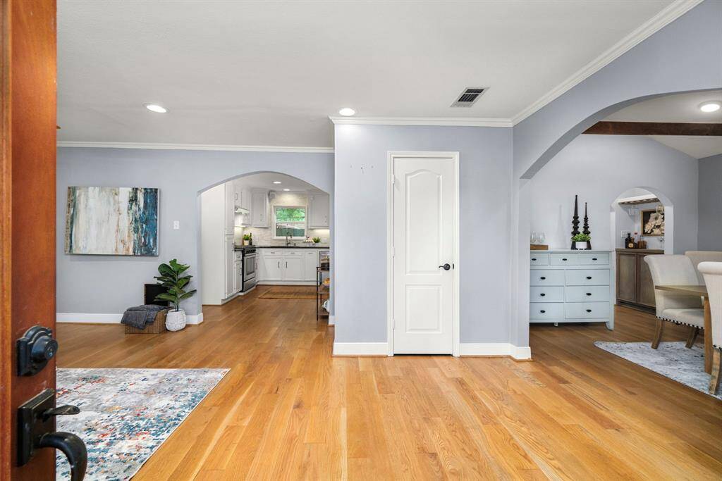 Love open spaces? This flowing layout with arched doorways and warm hardwoods is perfect for everyday living and entertaining.