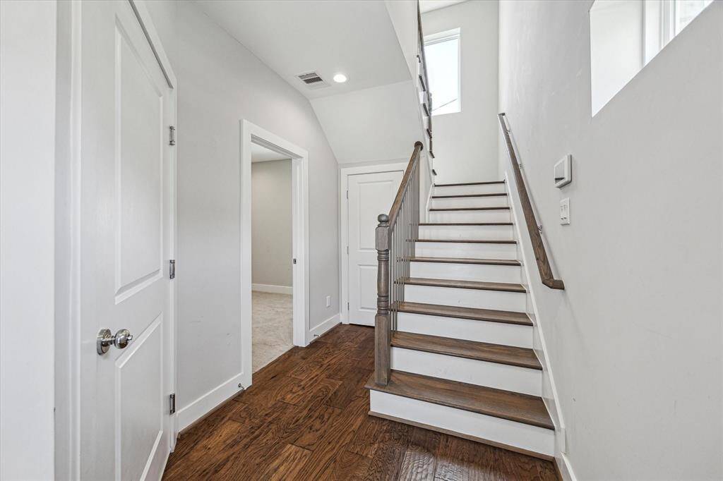 As you walk through the door, you are greeted by the first floor bedroom and garage access. There is also a sizable storage closet under the stairs!
