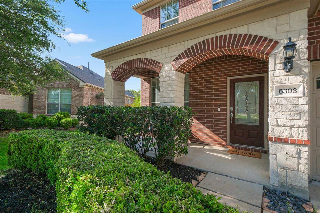 The covered front porch is inviting and adds to the curb appeal.