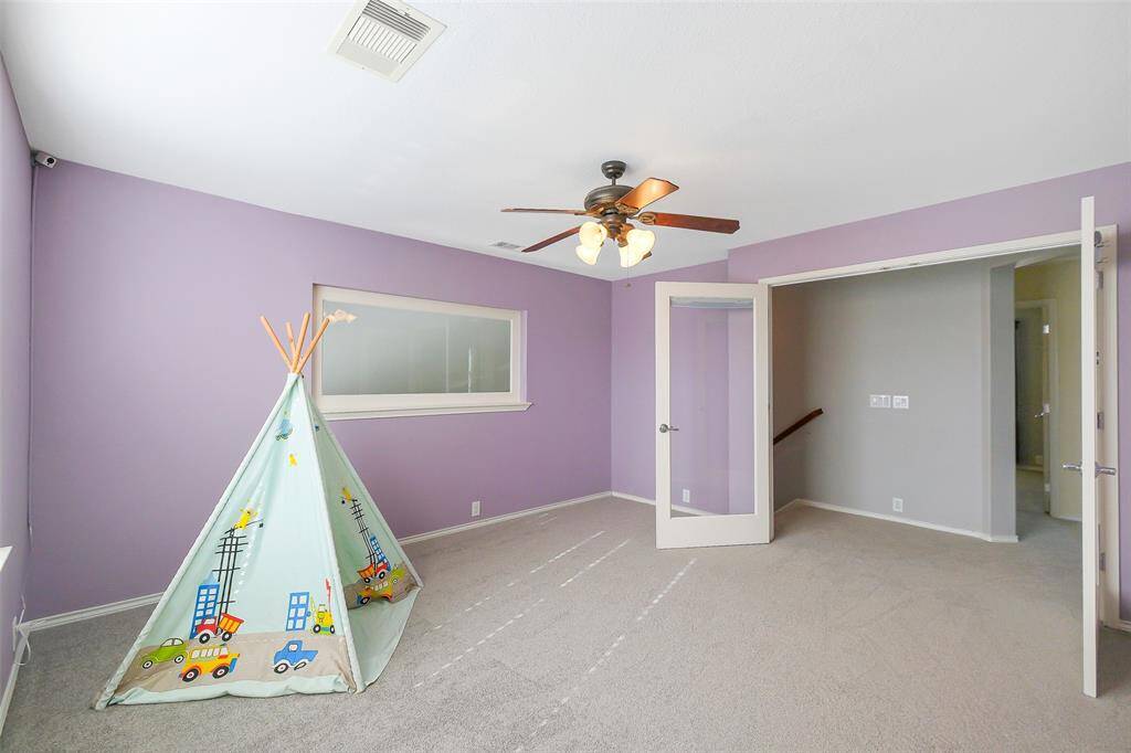 Upstairs you'll find a sizable game room or office with double doors to the hallway and large window overlooking the downstairs living area.