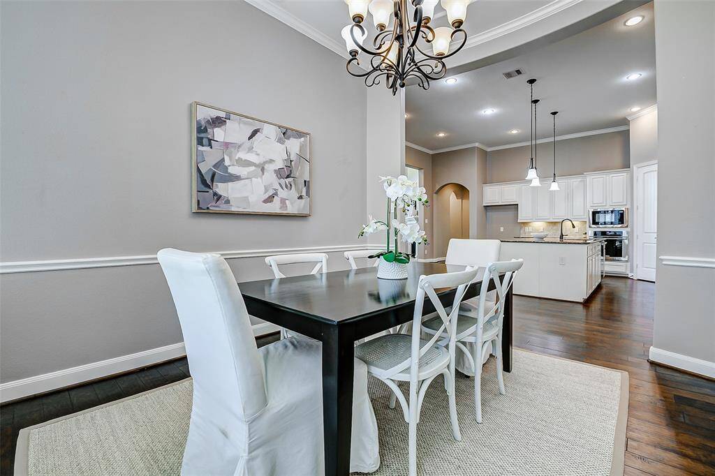 The modern dining area is open into the kitchen making entertainment a breeze.