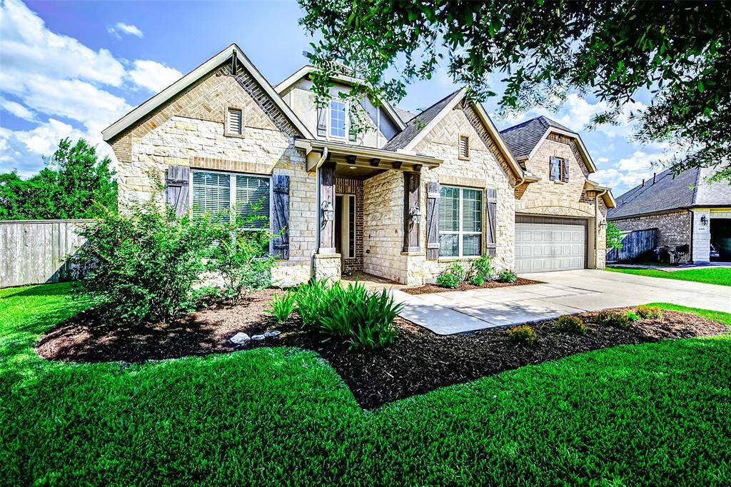 You will love the front yard with well-maintained greenery and a wide walkway to the front door, offering great curb appeal.