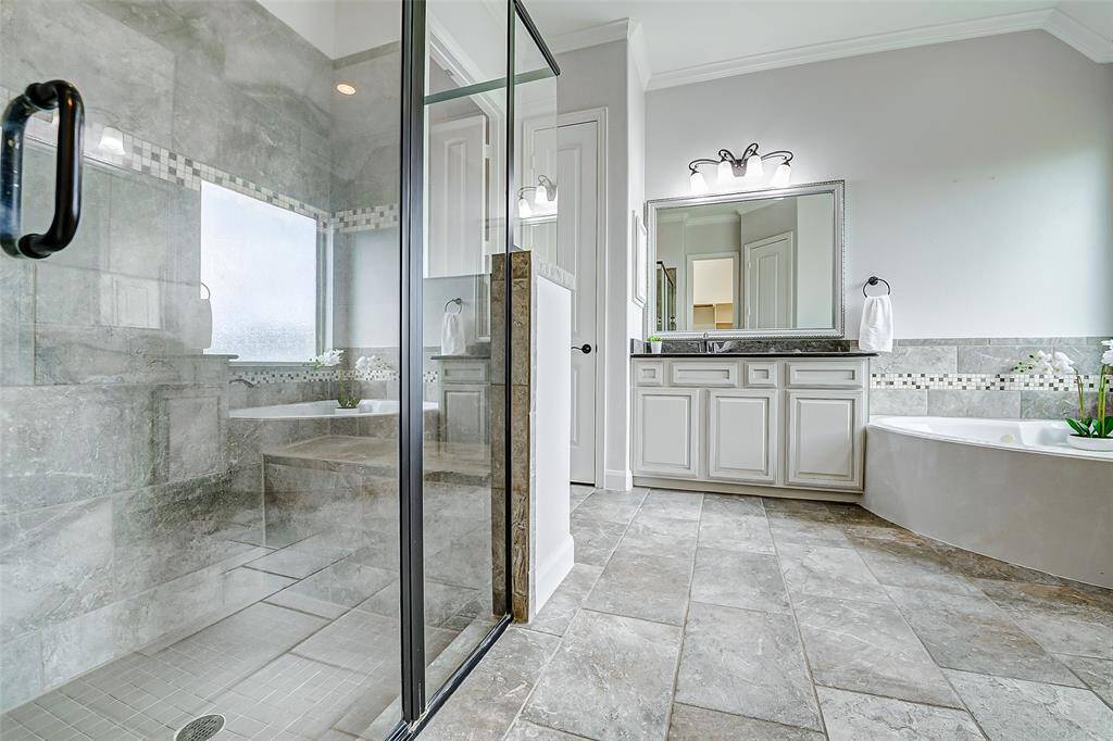 You will love the large modern glass-enclosed shower.