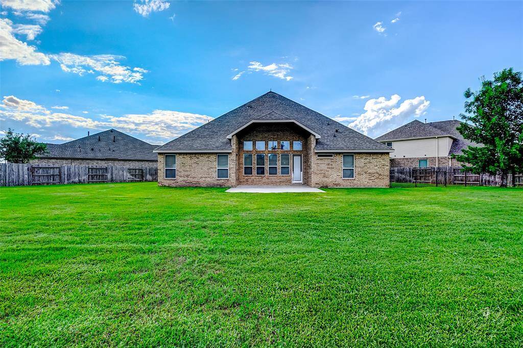 Enjoy the backyard from your covered patio.