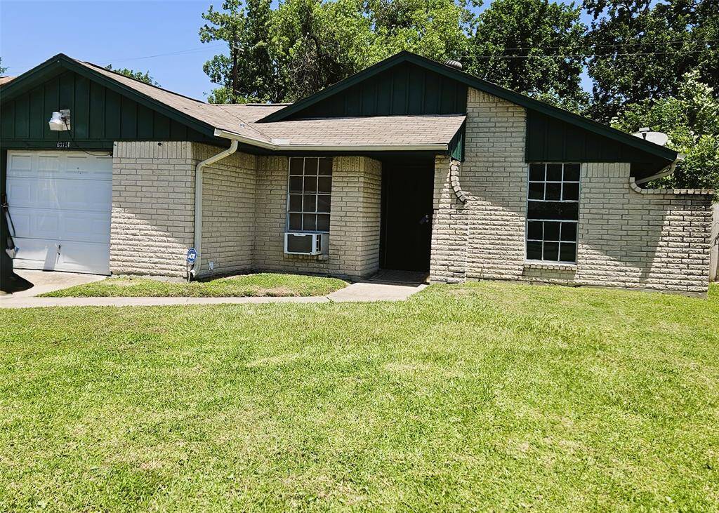 Charming and inviting home with a well-maintained exterior and lush green lawn, perfect for comfortable living.