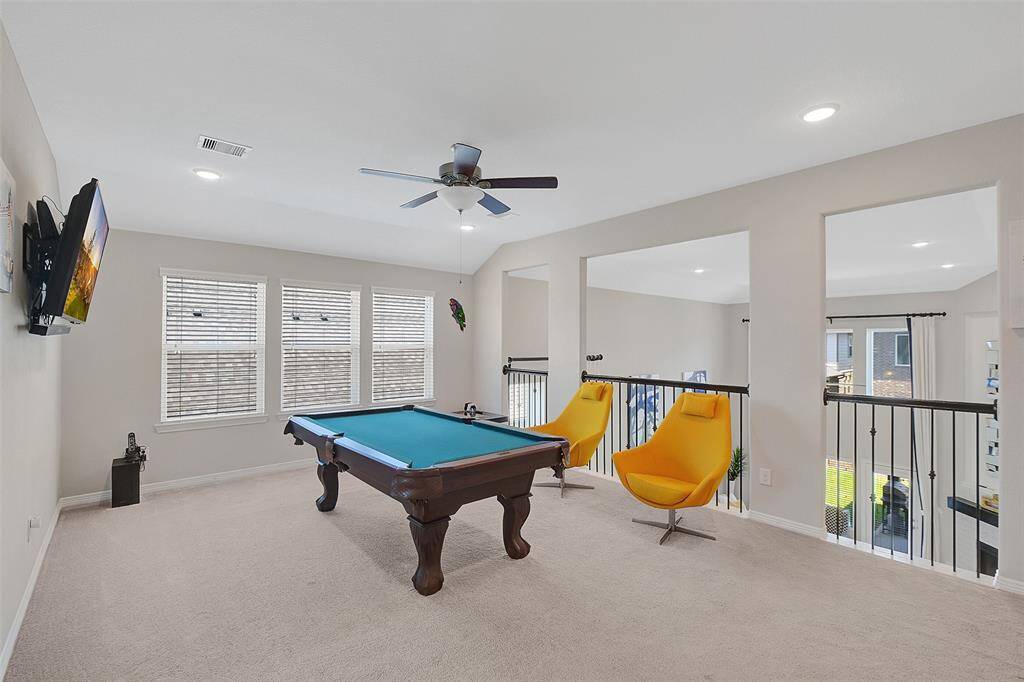 Game room upstairs also features lots of windows for natural lights.