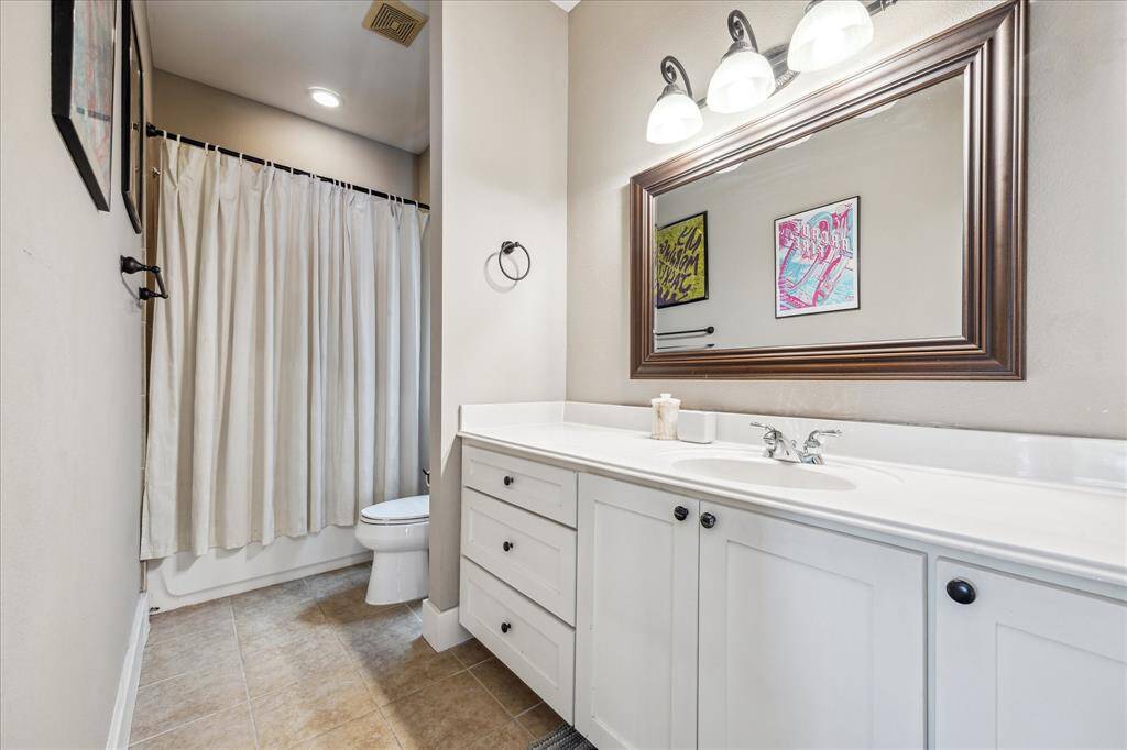 Bathroom located in the living quarters above the garage
