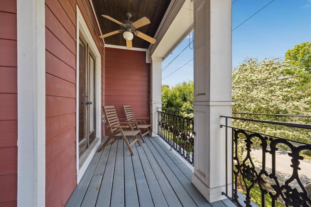 Upstairs balcony off the primary bedroom with views of the front of the home.