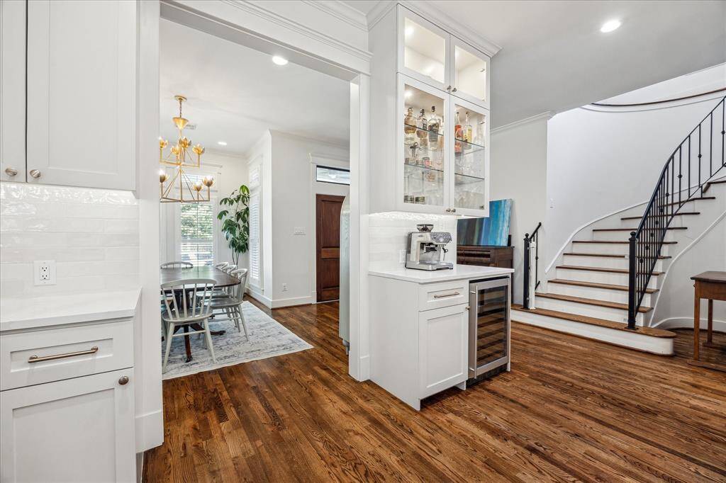 Built-in coffee and wine bar that is strategically located between the dining room and the kitchen