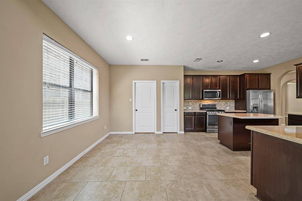 Breakfast Area for meals together with natural lighting from windows, tile flooring and tons of space
