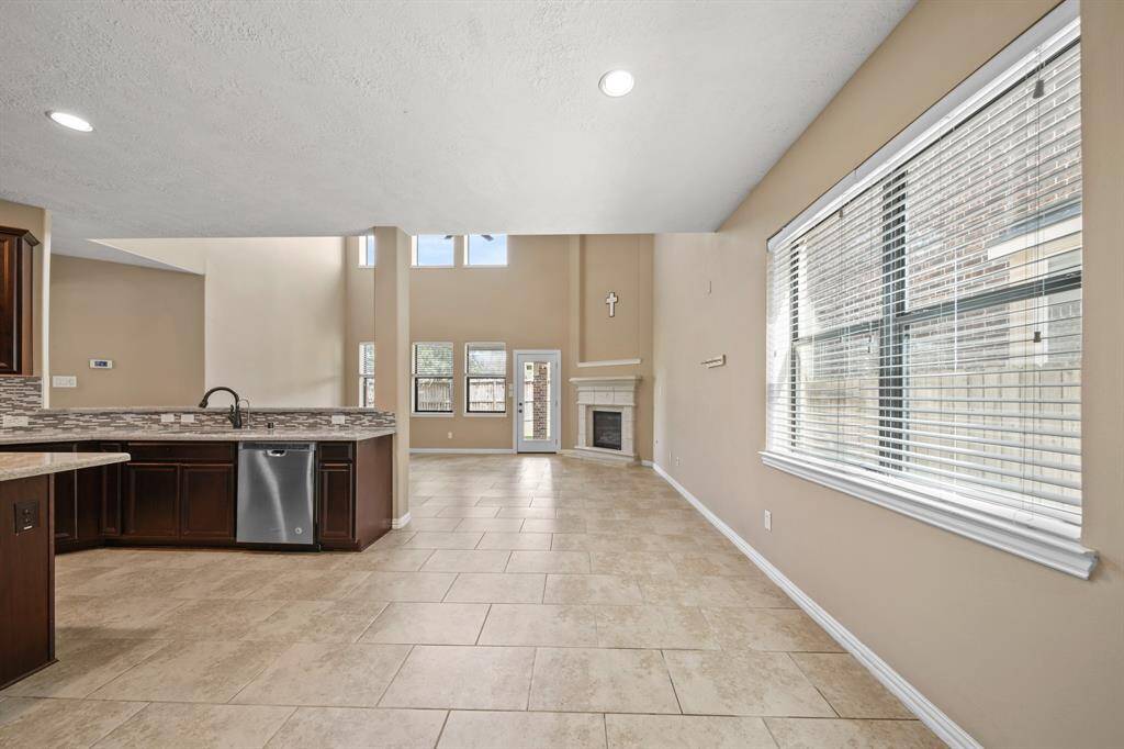 Alternate view from Breakfast Area showcasing the open concept offered on first level to the Gourmet Kitchen and Living Room