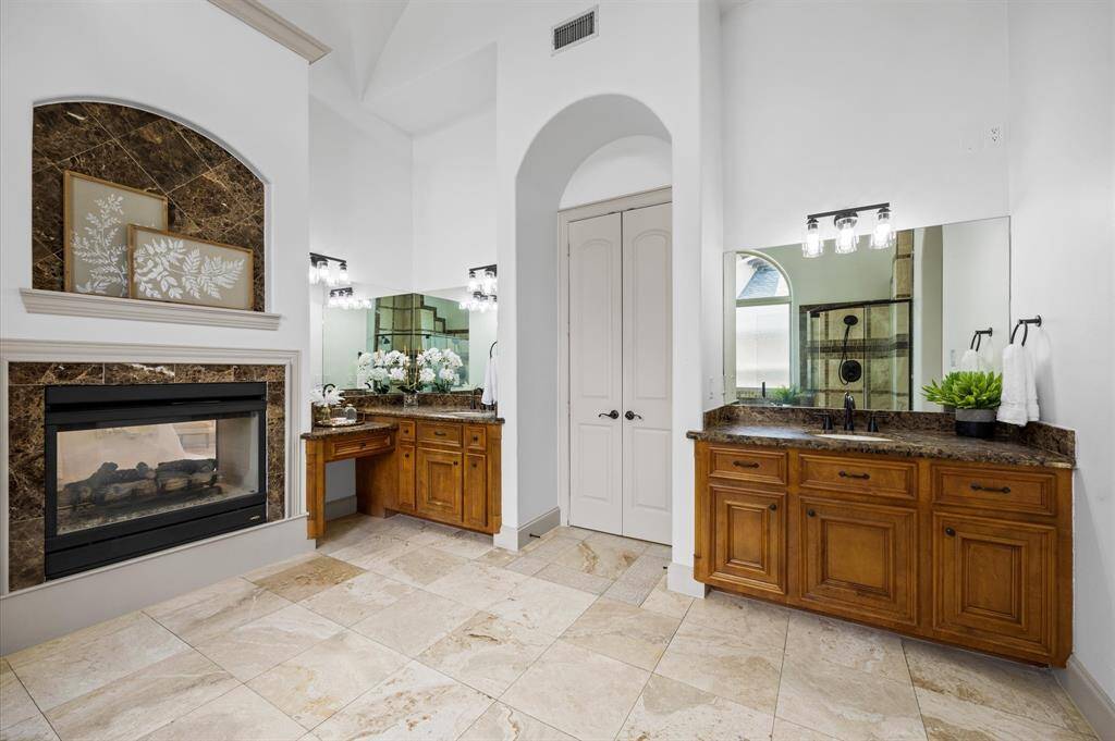 Primary bathroom with double sinks and vanity area