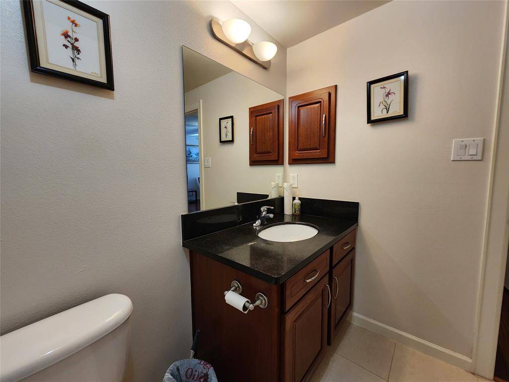 Hall bath vanity with medicine cabinet.