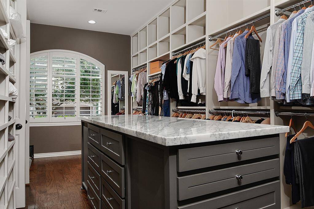 Impressive walk-in closet with custom storage solutions
