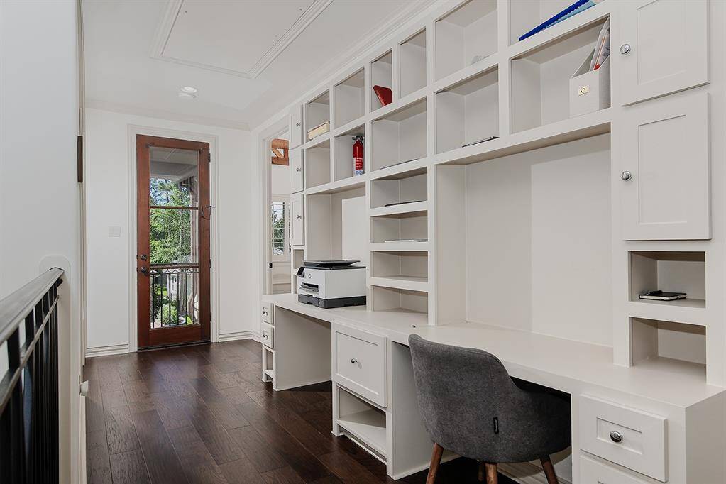 Upstairs study center with built-in desks and cabinets