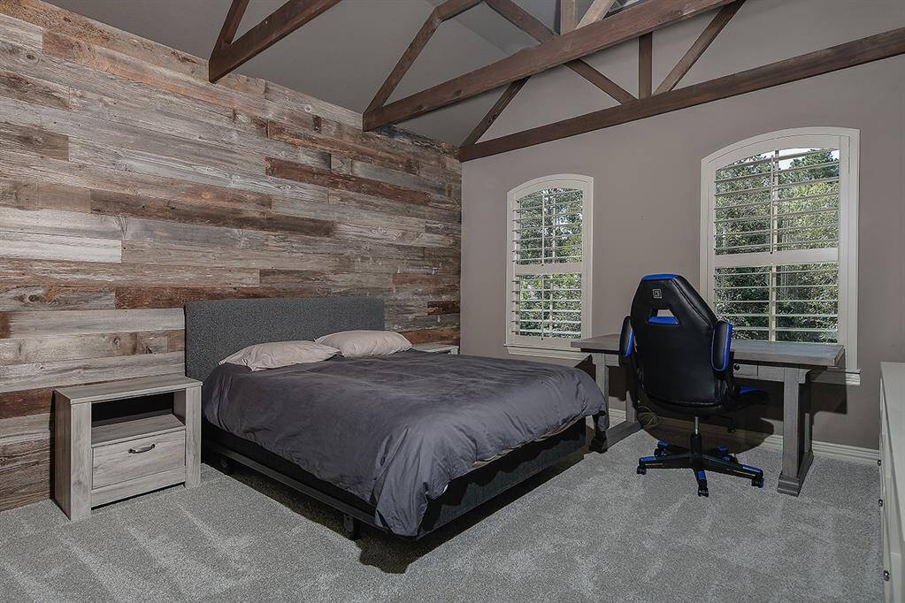 Guest Bedroom #3 with private bathroom and accent wall