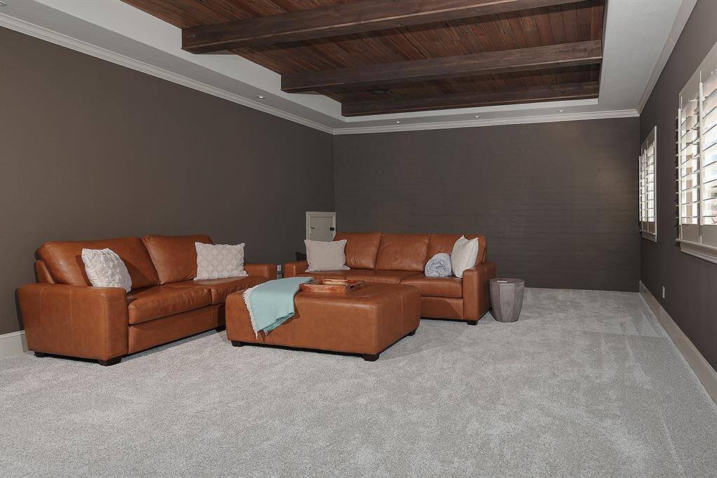Generous gameroom with wood accented ceiling