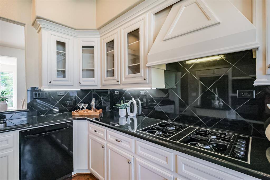 The 5 gas burner stove is alongside plenty of prep space.