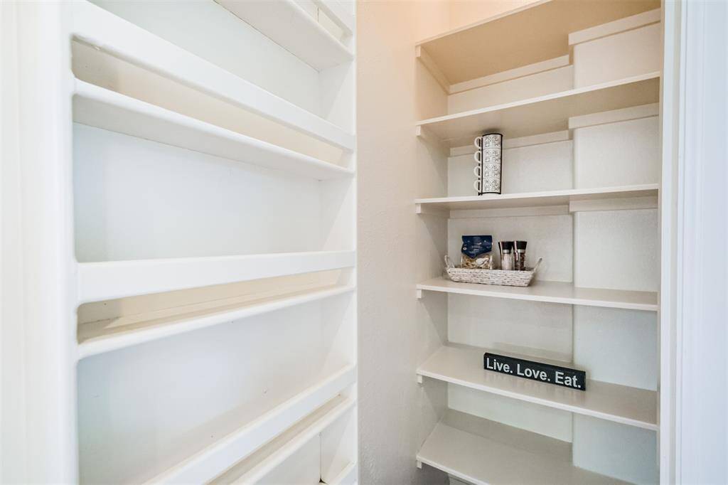 Useful walk-in pantry offers good storage solutions.