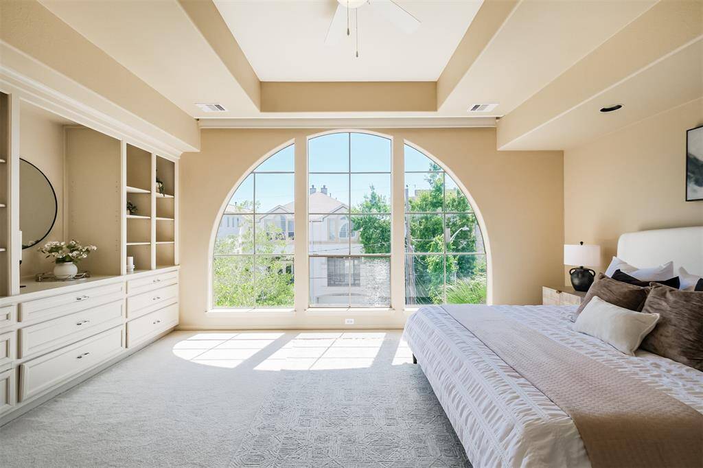 The 3rd floor features this gorgeous primary bedroom. Amazing amount of natural light and lovely views.