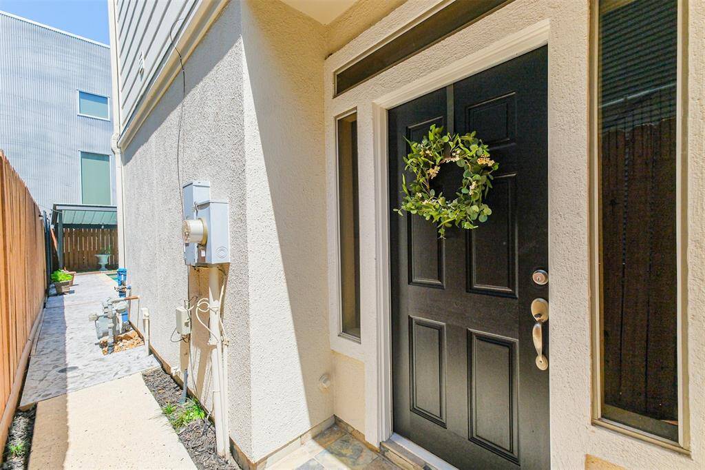 Lockable side gate leads to the front entrance.