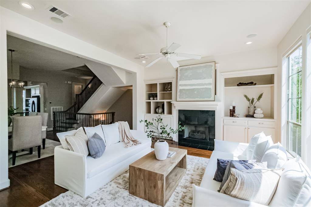 The living room has useful built in cabinets.