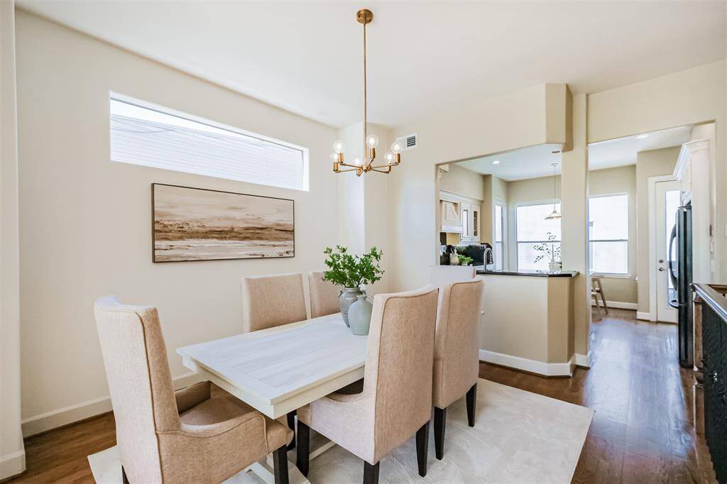 The floor effortlessly flows into the dining room, which can easily seat 8.