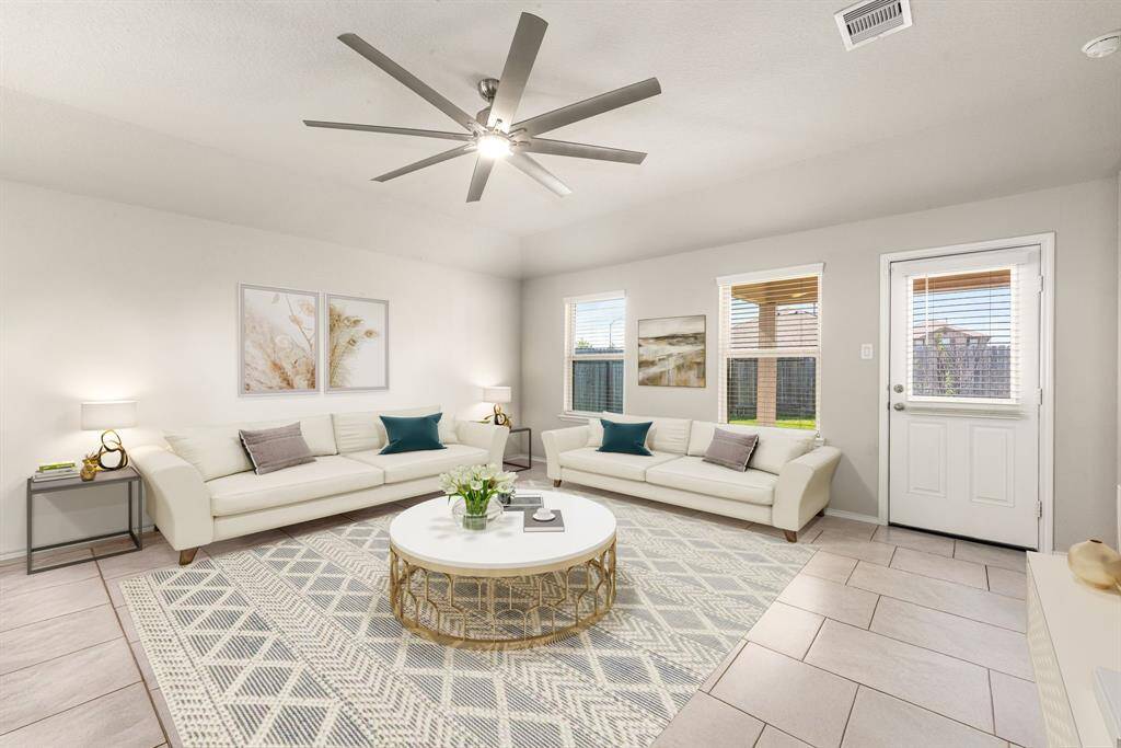 Gather the family and guests together in your lovely living room! Featuring high ceilings, ceiling fan with lighting, neutral paint, gorgeous tile floors and large windows that provide plenty of natural lighting throughout the day. *virtual staging*
