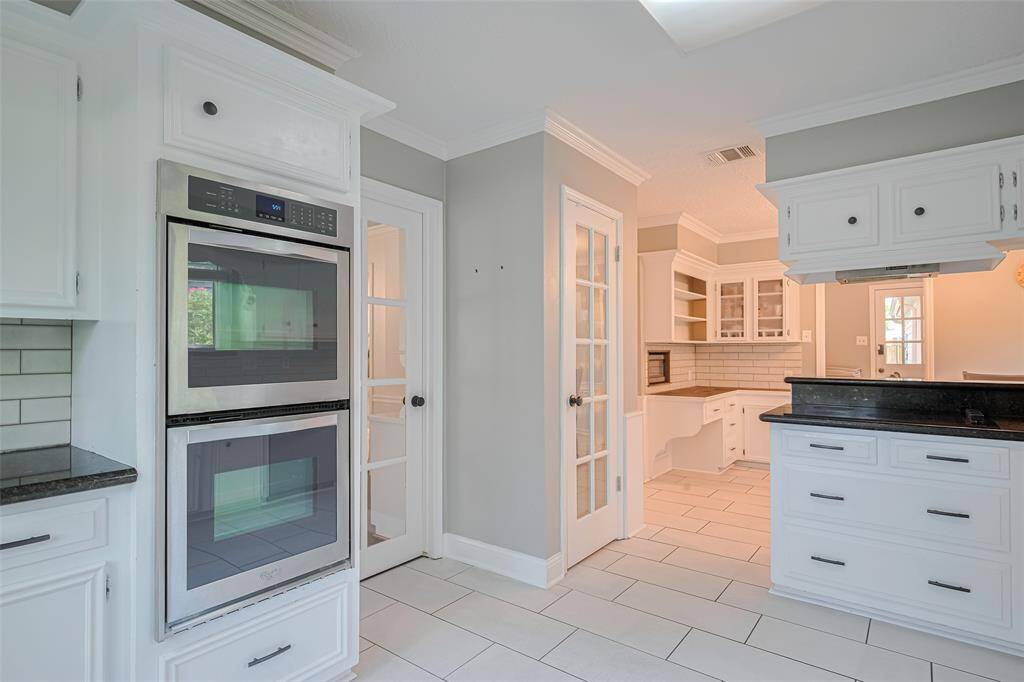 A view from the kitchen to the breakfast area, all stainless steel appliances were replaced in 2017-2018.