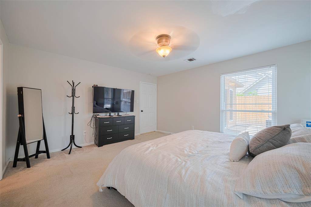 Another angle of the spacious primary bedroom.