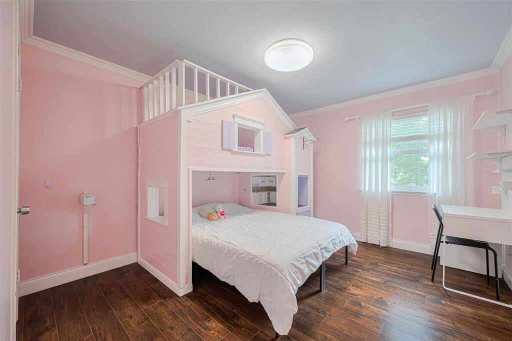 The upstairs fourth bedroom is perfect for your little princess, offering a spacious walk-in closet.