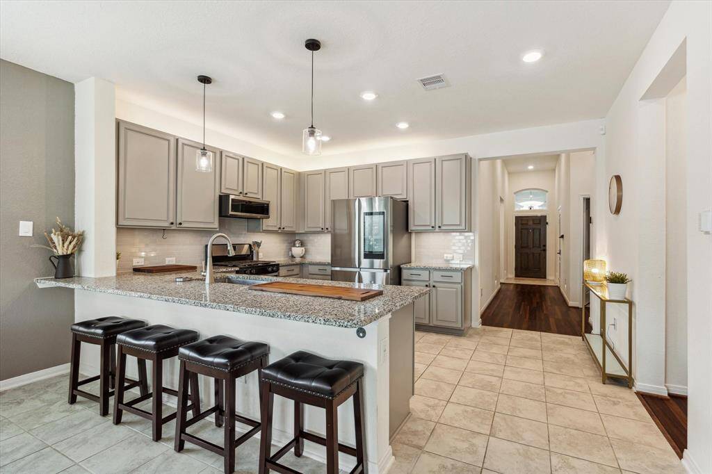 Offer guests or the family a seat at the island for casual dining.