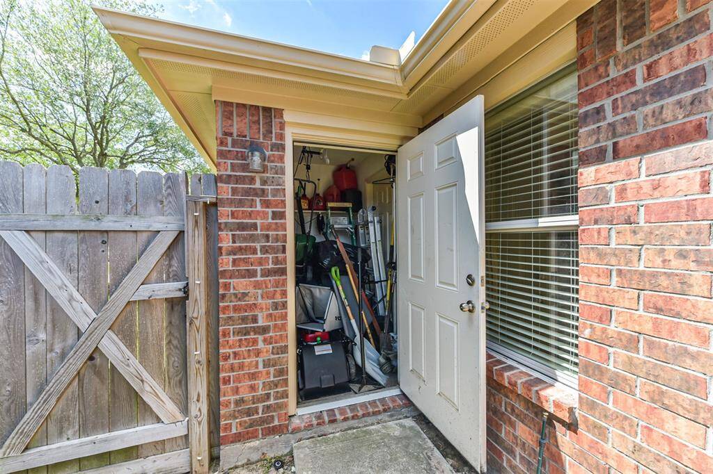 Great yard storage with door to garage and one to backyard.