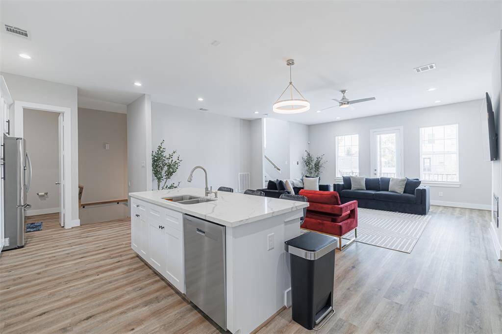 Another view of the kitchen looking into the family room. Balcony is located off the 2nd floor.
