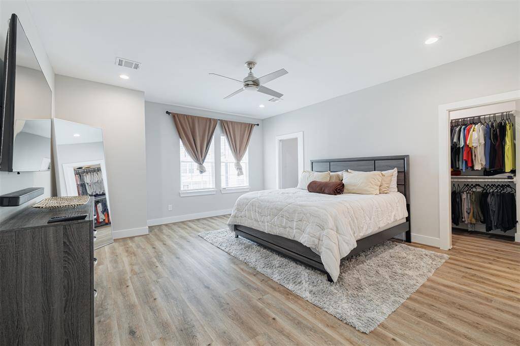 The tranquil primary suite, a true retreat with a spacious walk-in closet and an ensuite bath.